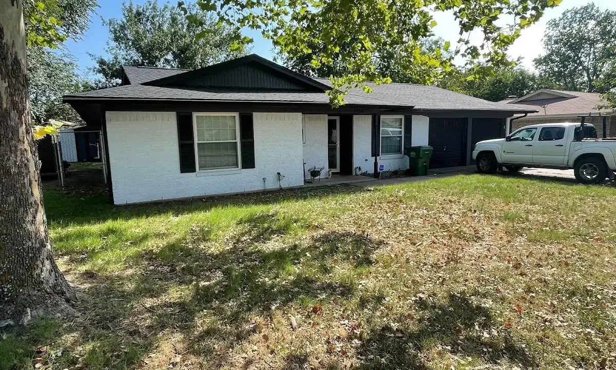 Professional roofing crew working on a residential roof in Melbourne